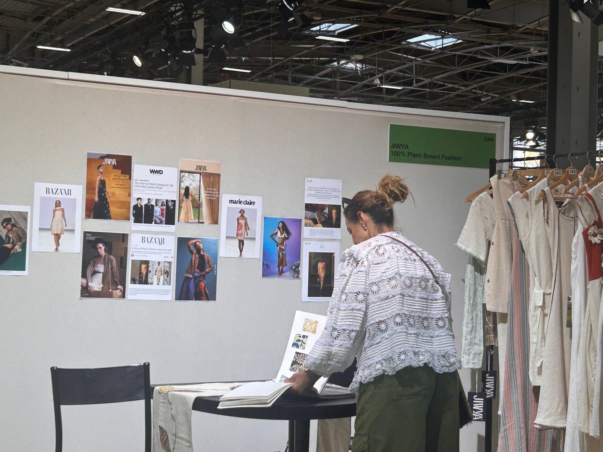 Myriam reviewing a fashion collection at an international trade show